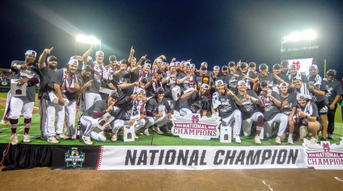 Jun 30, 2021; Omaha, Nebraska, USA; The Mississippi St. Bulldogs pose for a team photo after winning the national championship against the Vanderbilt Commodores at TD Ameritrade Park.